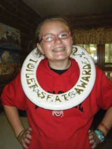 Erin as a trailblazer camper with the coveted golden toilet seat award! 